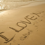 ‘I love you’ written in sand on beach